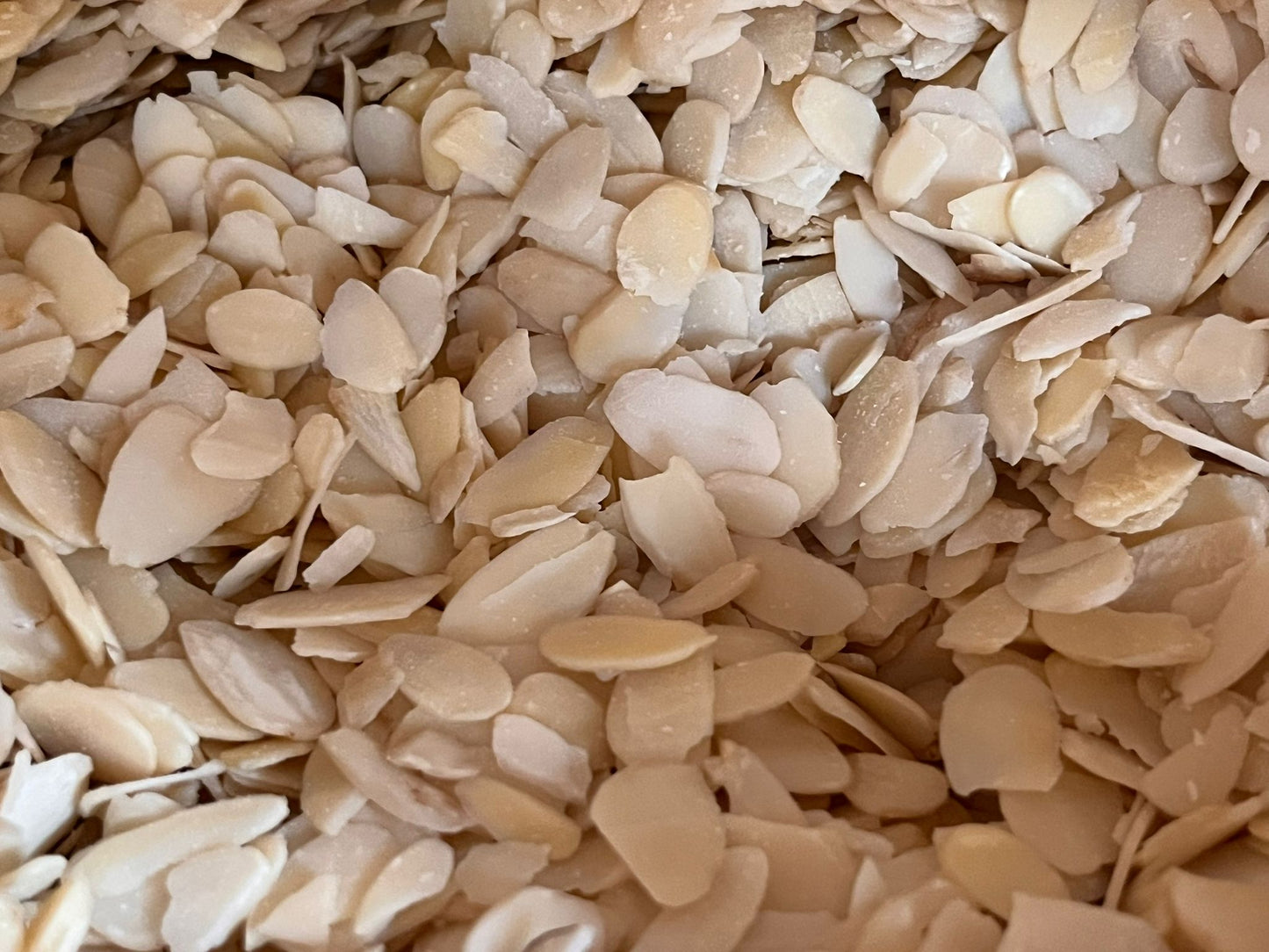 Bulk flaked almonds from The Eco Basket, showing thin, pale almond slices ready for cooking, baking, or snacking.”