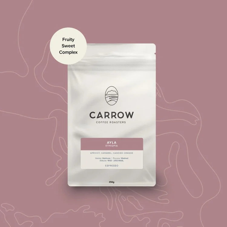 Carrow Coffee Ayka packaging on a pink background