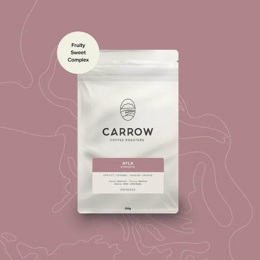 Carrow Coffee Ayka packaging on a pink background