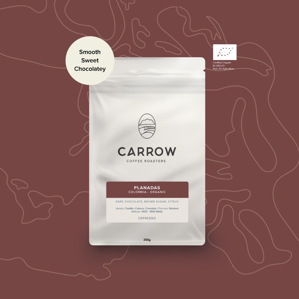 Carrow Coffee Roasters packaging on a maroon background