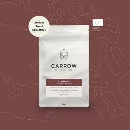 Carrow Coffee Roasters packaging on a maroon background